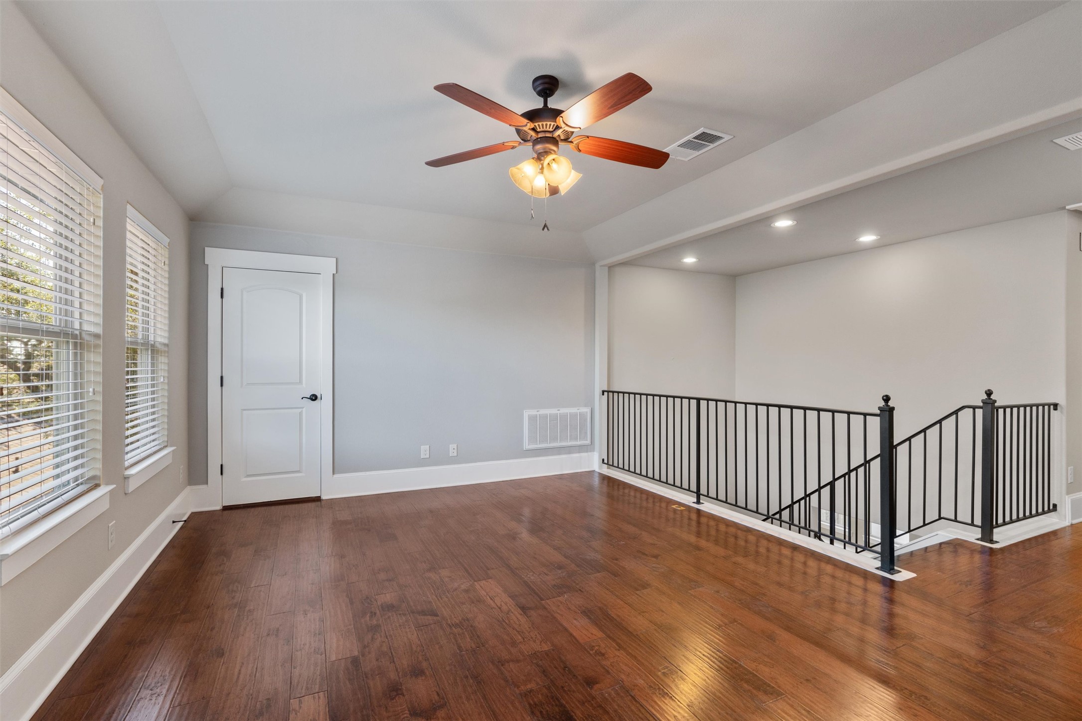 8417 Etienne Cove Austin, TX 78759 - Photo 21 of 35 Rich hardwood floors complement this versatile upper-level living space, complete with a ceiling fan and ample natural light.