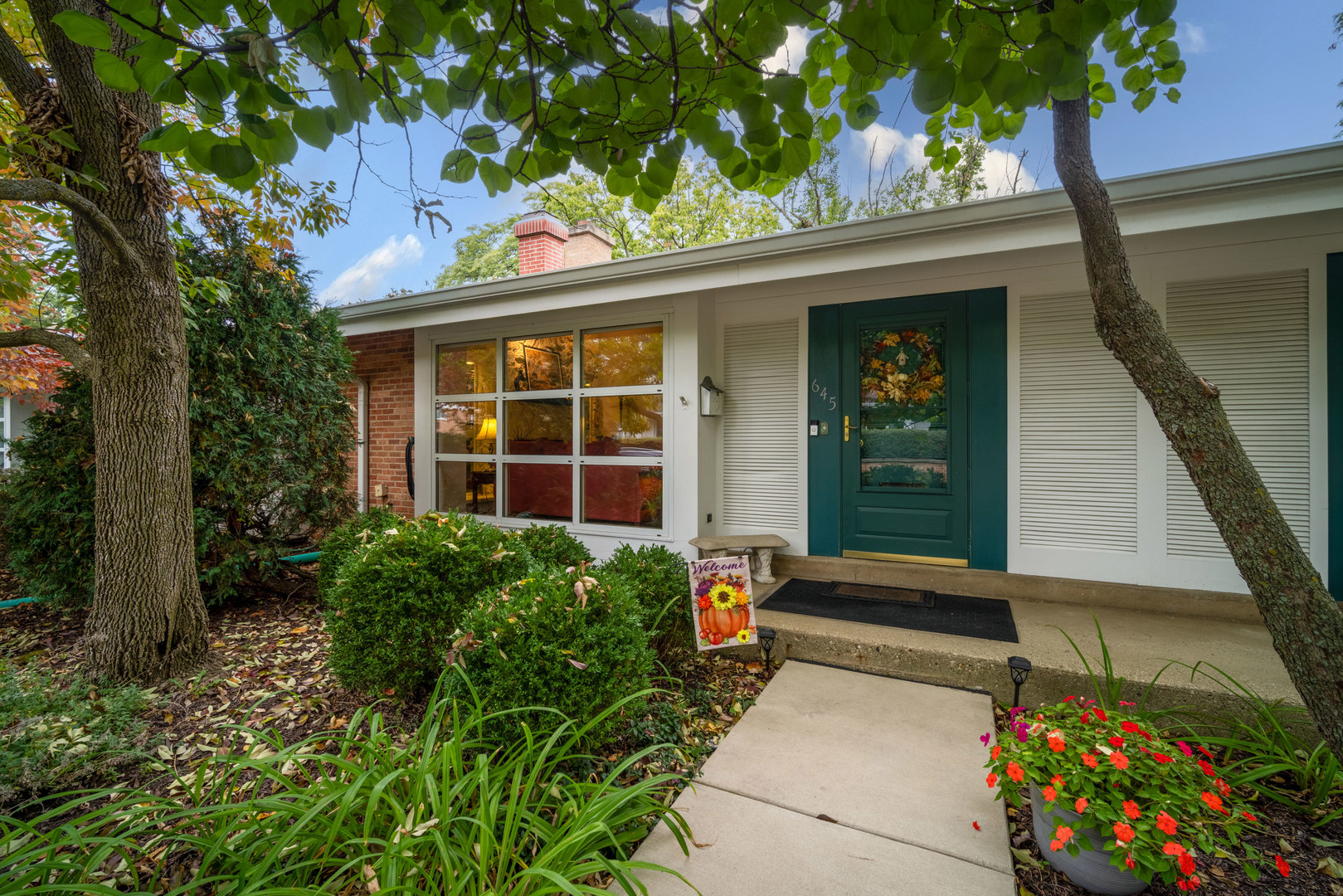 a front view of a house with a yard
