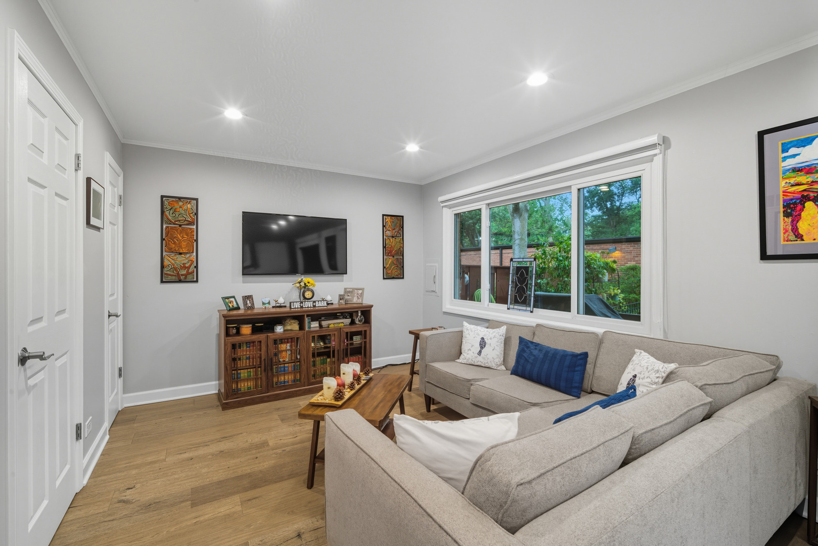 645 Spring Road Glenview, IL 60025 - Photo 11 of 31 a living room with furniture and a flat screen tv