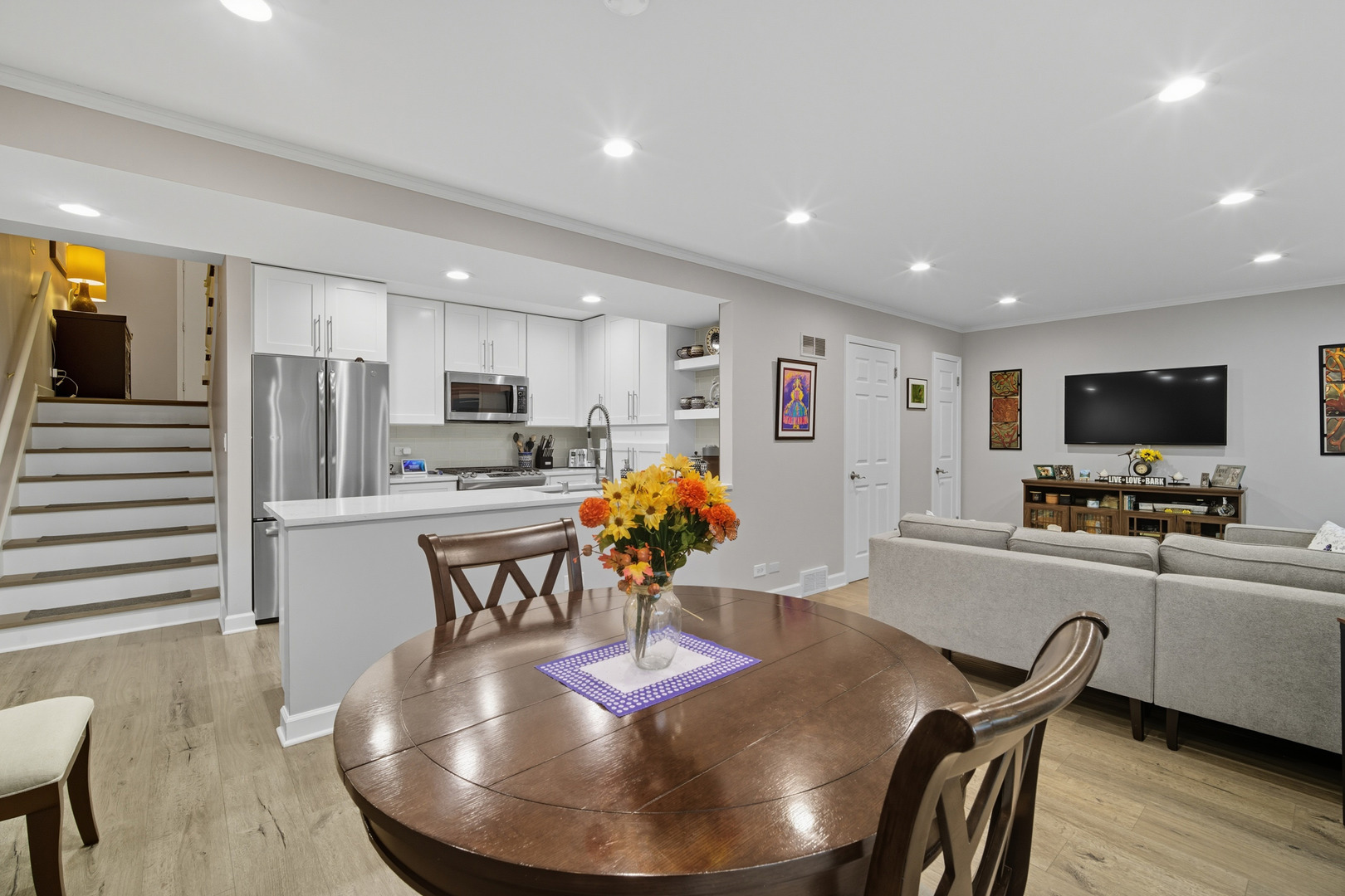 645 Spring Road Glenview, IL 60025 - Photo 14 of 31 a living room with stainless steel appliances furniture and a kitchen view