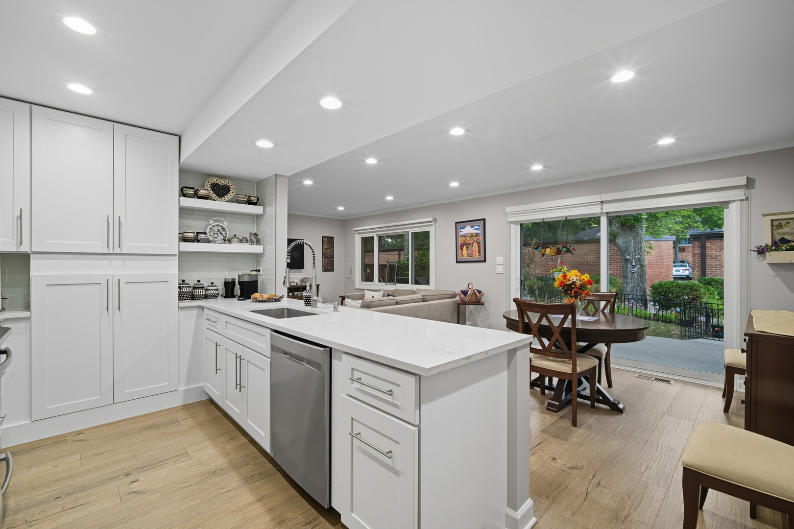 645 Spring Road Glenview, IL 60025 - Photo 15 of 31 a kitchen with stainless steel appliances kitchen island granite countertop a sink and cabinets