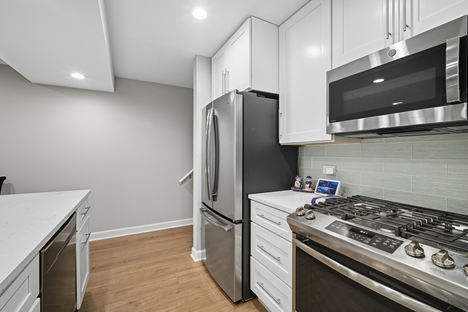 645 Spring Road Glenview, IL 60025 - Photo 18 of 31 a kitchen with stainless steel appliances a stove a microwave and a refrigerator