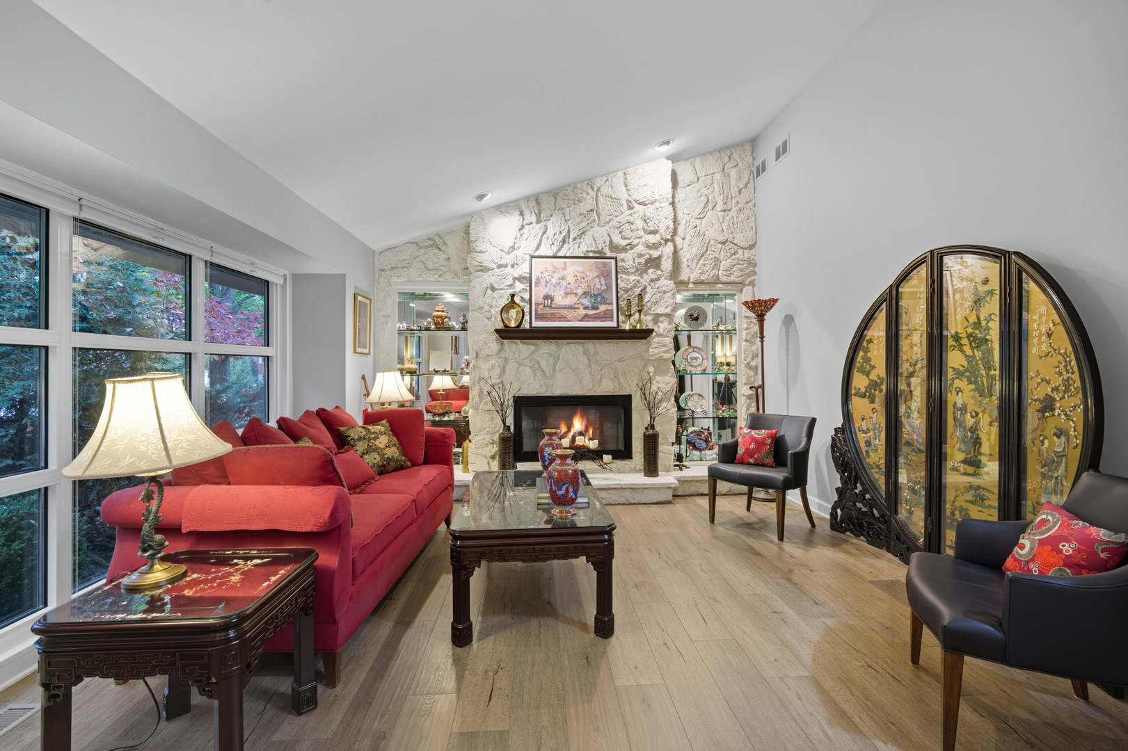 645 Spring Road Glenview, IL 60025 - Photo 5 of 31 a living room with furniture a fireplace and a floor to ceiling window