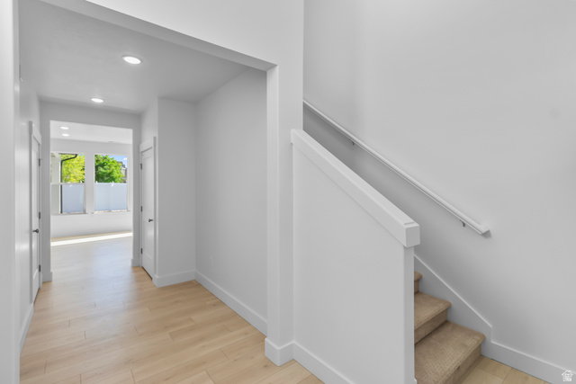 1237 West 500 South, Unit 230 Logan, UT 84321 - Photo 14 of 42 Entryway featuring recessed lighting, wood-finish flooring, and a staircase with carpeted treads