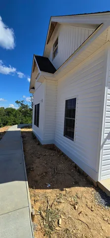 a view of a backyard of the house