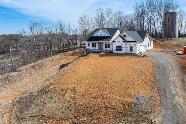 a view of multiple houses with a yard