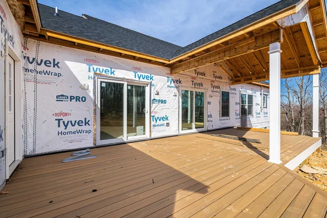 a view of a room with wooden floor