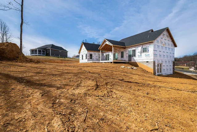 a view of a large house with a yard