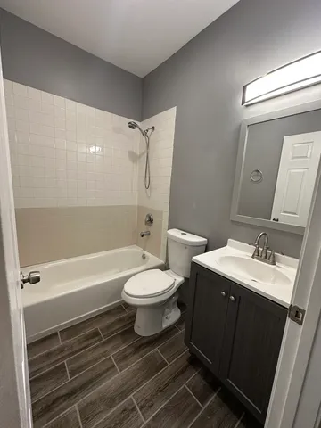 a bathroom with a toilet a sink and bathtub