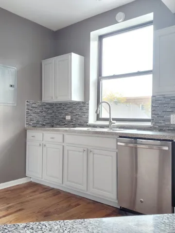 a bathroom with a sink and a window