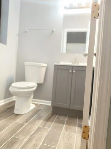 a bathroom with a toilet and a sink