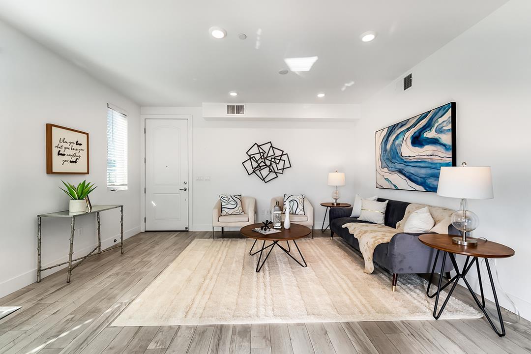 1421 Nightshade Road, Unit 30 Milpitas, CA 95035 - Photo 1 of 28 a living room with furniture and a table