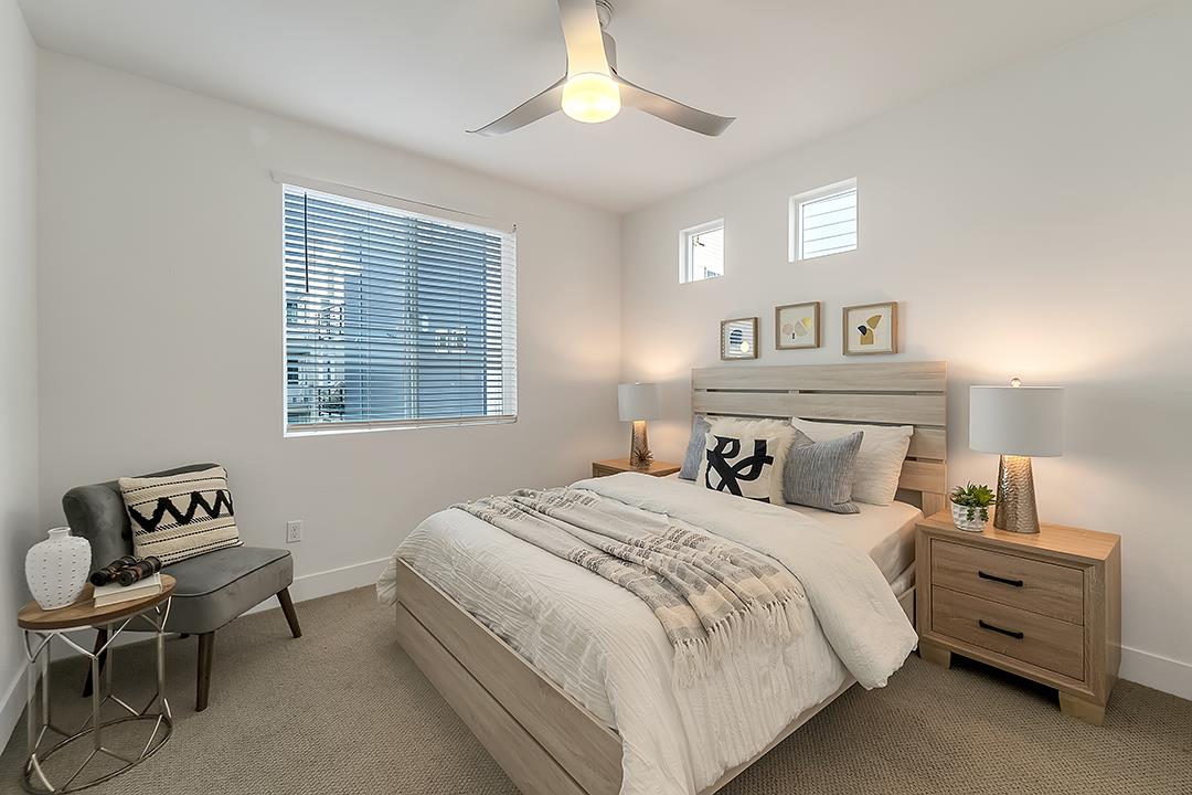 1421 Nightshade Road, Unit 30 Milpitas, CA 95035 - Photo 11 of 28 a bedroom with a bed and a chandelier