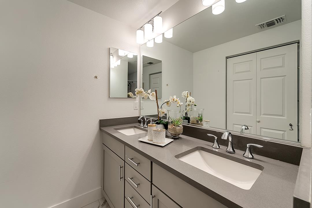 1421 Nightshade Road, Unit 30 Milpitas, CA 95035 - Photo 15 of 28 a bathroom with double sink and a mirror