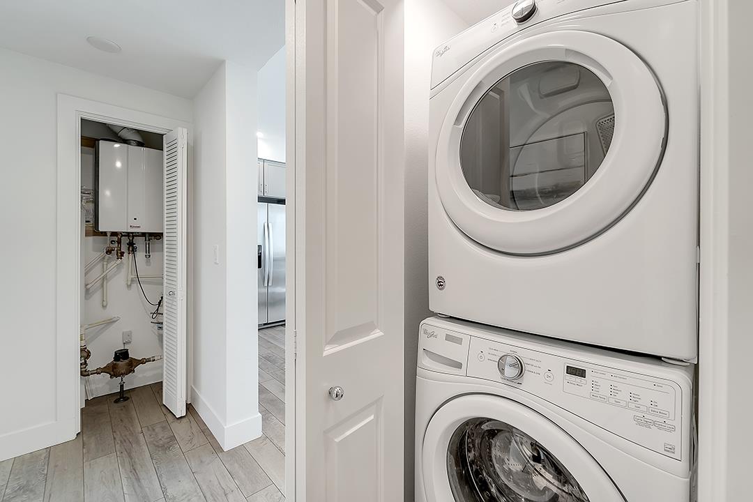 1421 Nightshade Road, Unit 30 Milpitas, CA 95035 - Photo 16 of 28 a view of a hallway with washer and dryer