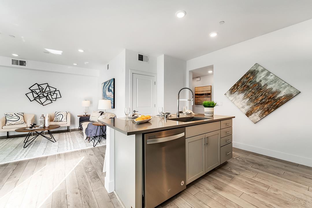 1421 Nightshade Road, Unit 30 Milpitas, CA 95035 - Photo 5 of 28 a kitchen with stainless steel appliances granite countertop a sink stove and cabinets