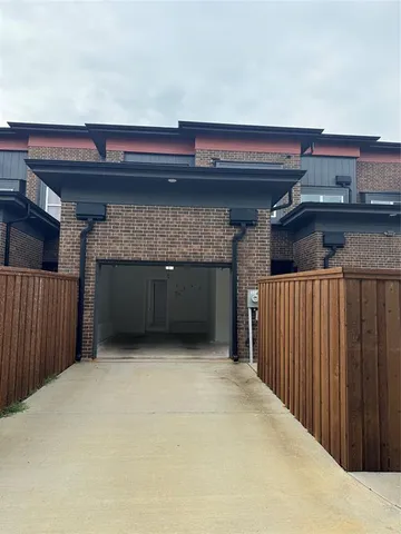 a hallway with a wooden fence