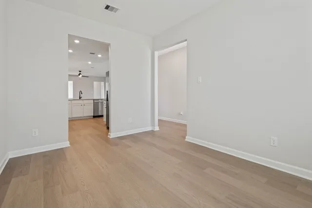 a kitchen with stainless steel appliances a stove microwave and cabinets