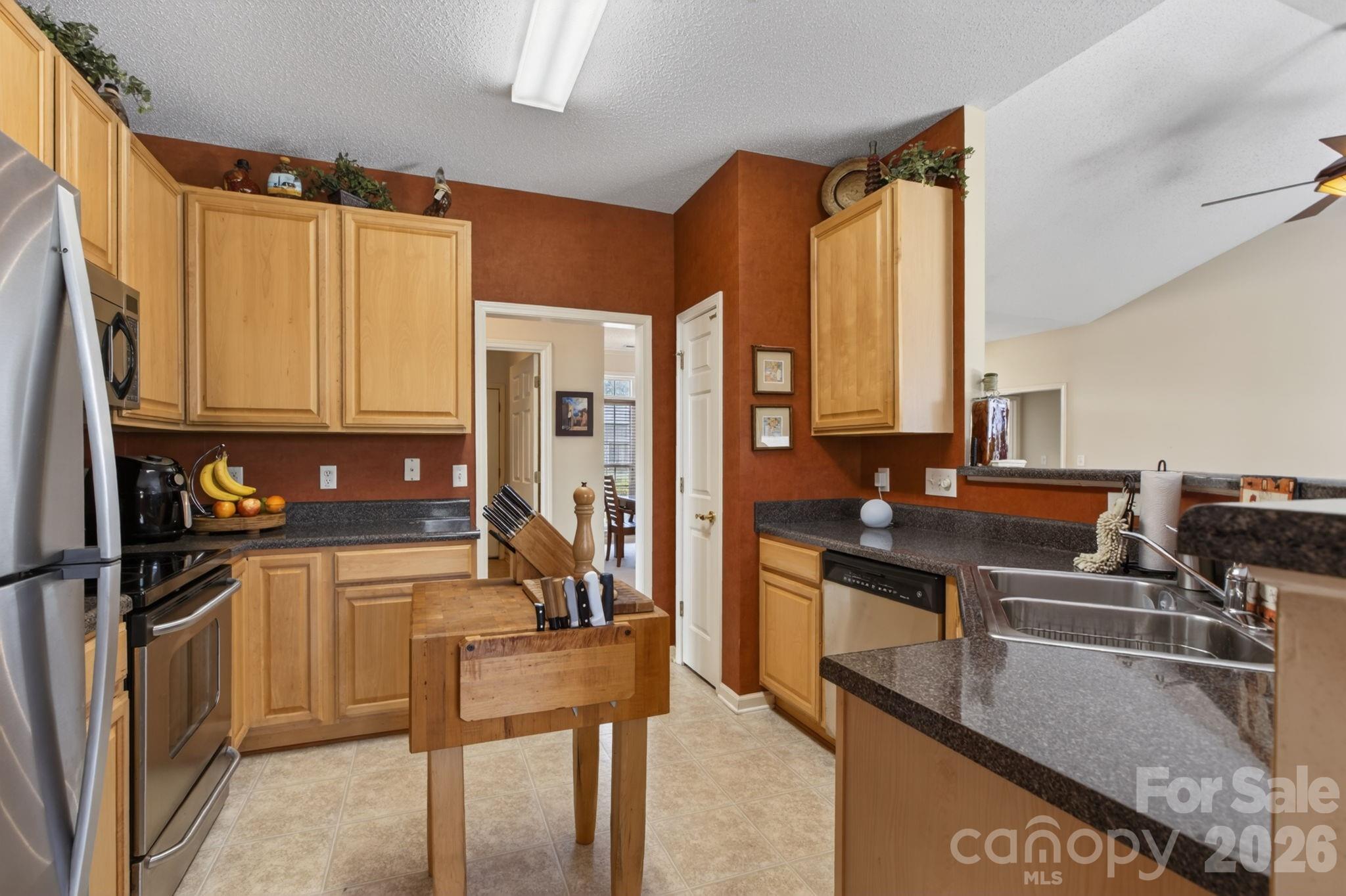 268 Farm Valley Road Fletcher, NC 28732 - Photo 15 of 30 a kitchen with stainless steel appliances granite countertop a stove a refrigerator and a microwave