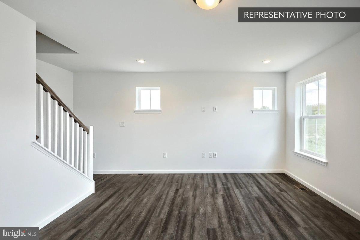151 Redbud Road Bellefonte, PA 16823 - Photo 7 of 8 wooden floor in an empty room with a window
