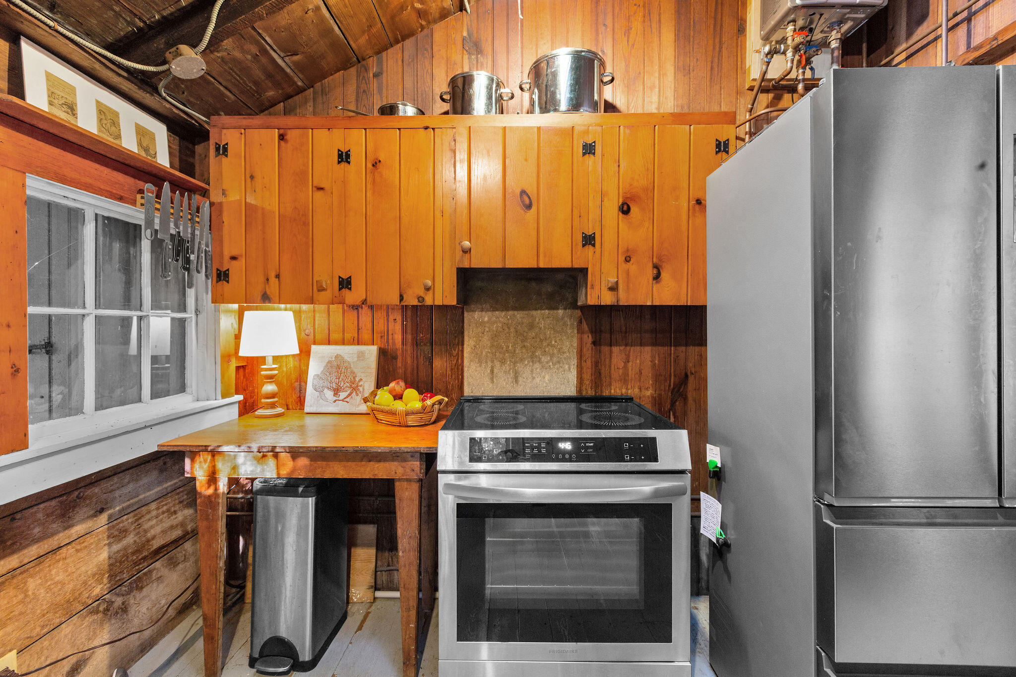 35 Bradford Road Brewster, MA 02631 - Photo 12 of 27 a kitchen with stainless steel appliances granite countertop a stove and a refrigerator