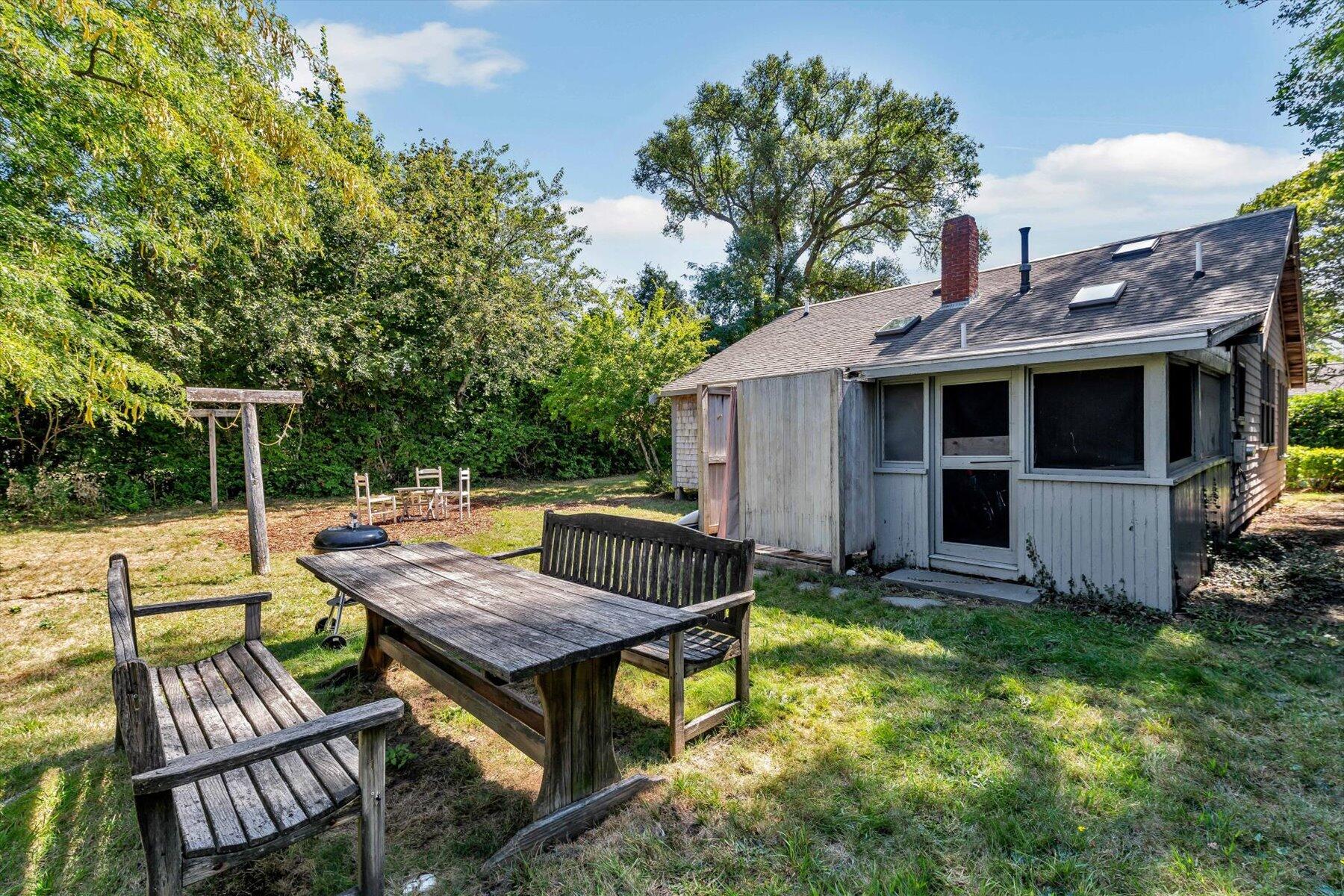 35 Bradford Road Brewster, MA 02631 - Photo 23 of 27 a view of house with backyard and furniture