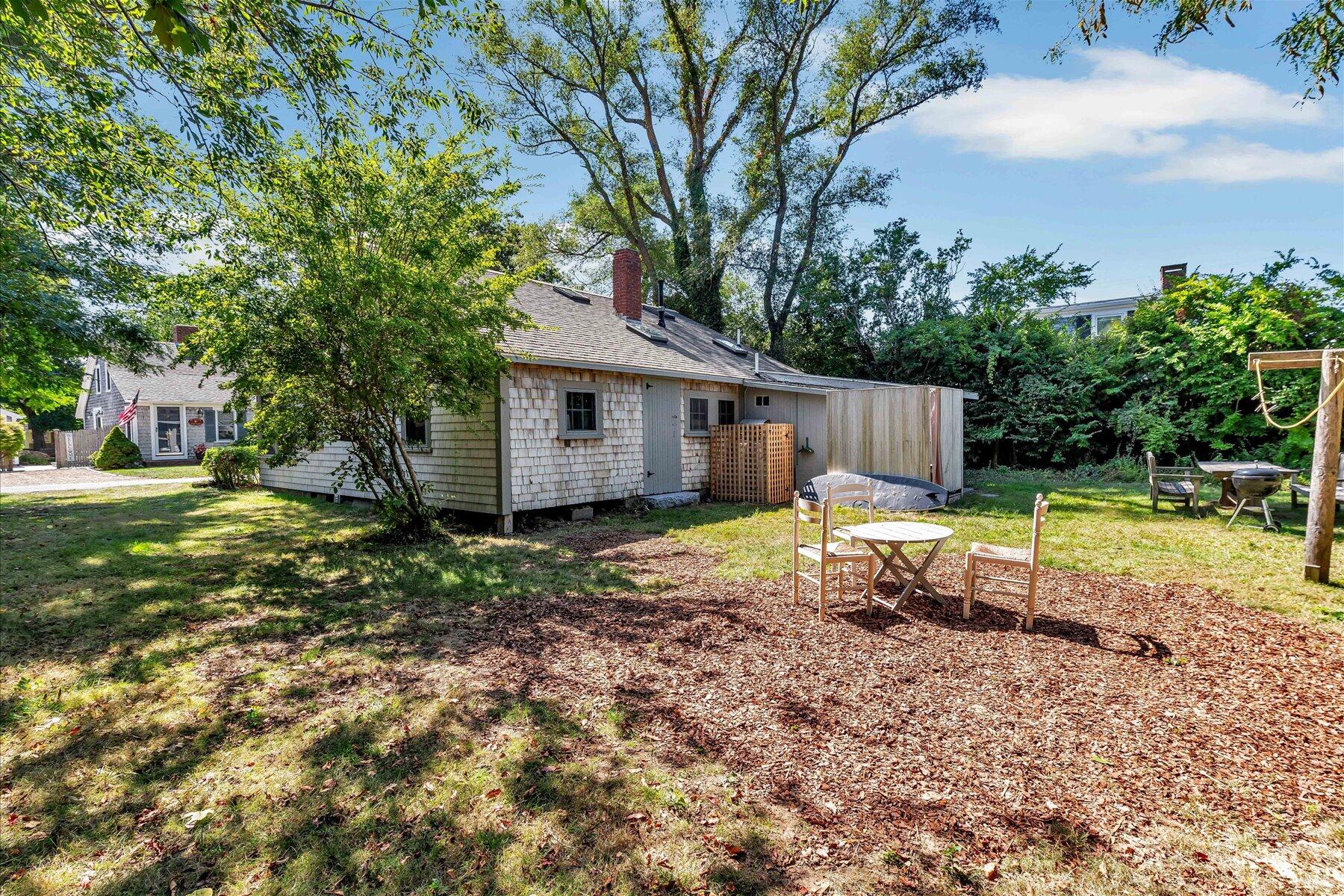 35 Bradford Road Brewster, MA 02631 - Photo 24 of 27 a view of a house with a yard