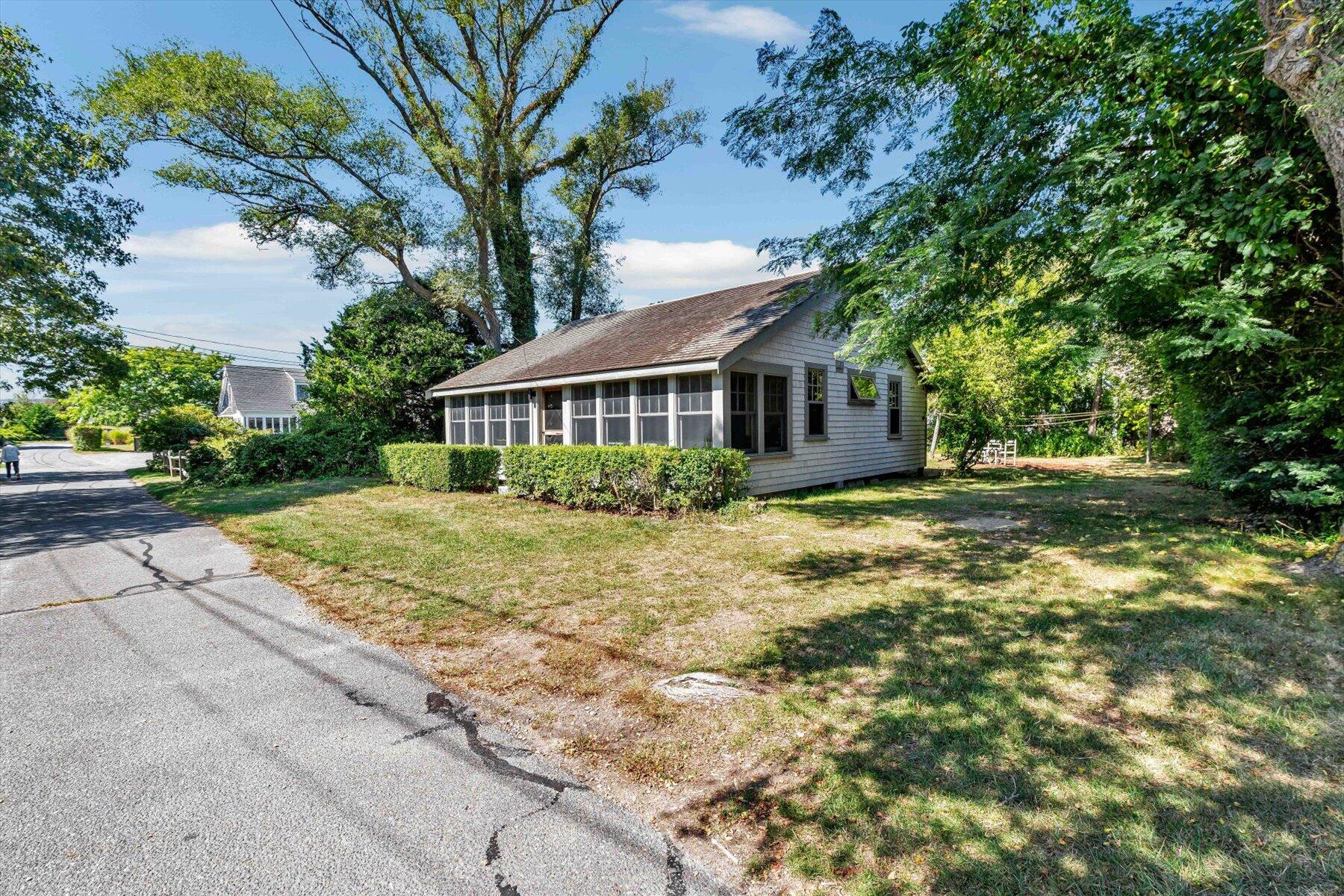 35 Bradford Road Brewster, MA 02631 - Photo 4 of 27 a front view of a house with a garden