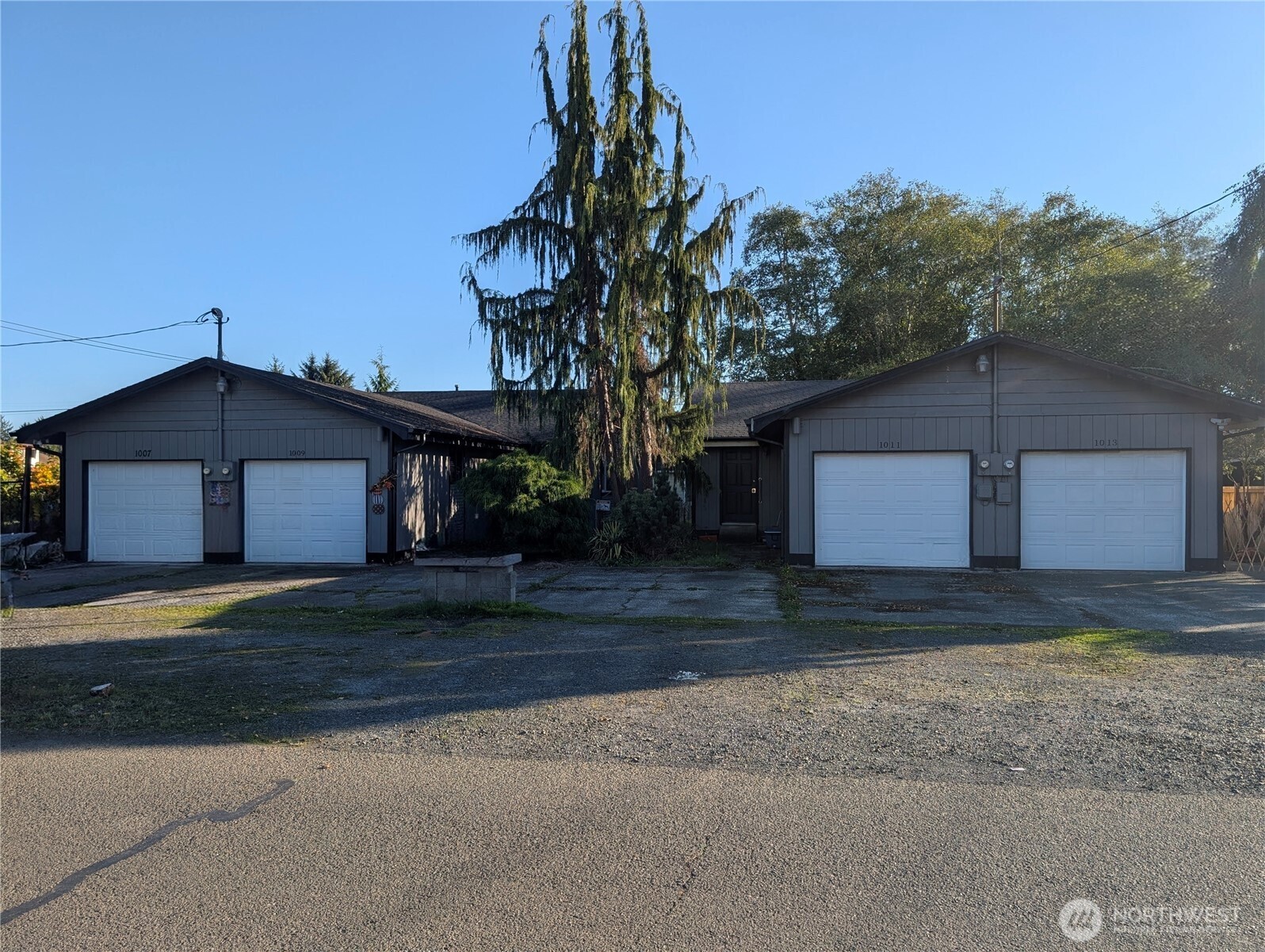 1007 MacFarlane Street Aberdeen, WA 98520 - Photo 20 of 23 a view of a house with a yard and garage