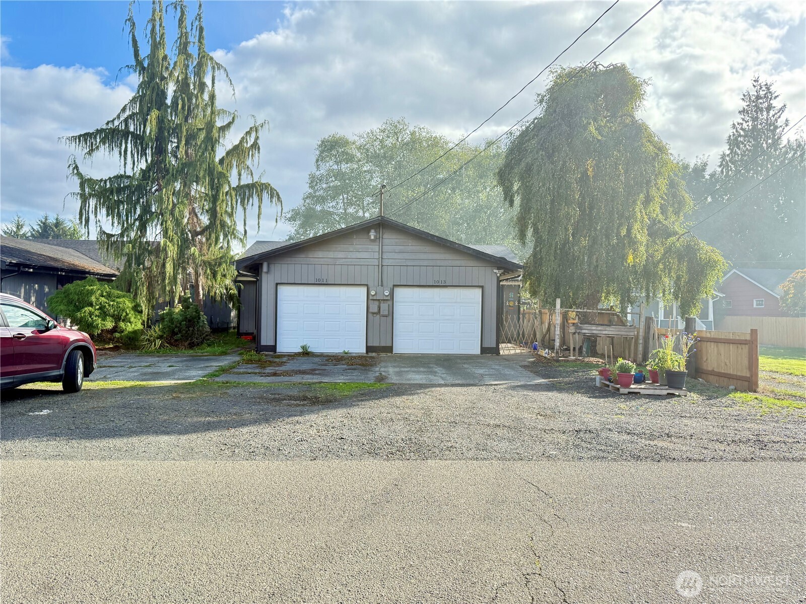 1007 MacFarlane Street Aberdeen, WA 98520 - Photo 2 of 23 a view of a house with a yard and garage