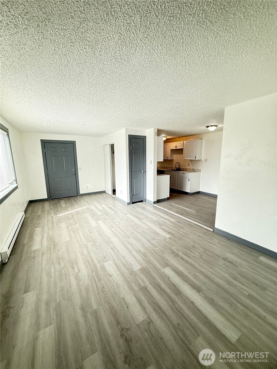 1007 MacFarlane Street Aberdeen, WA 98520 - Photo 7 of 23 a view of a livingroom with wooden floor