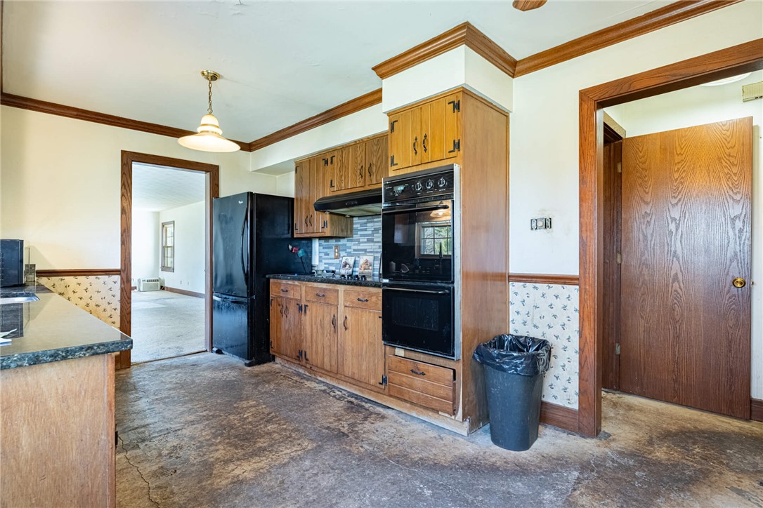 6885 Garber Road Clayton, OH 45415 - Photo 7 of 24 This functional kitchen features ample cabinetry and integrated appliances for comfortable living.