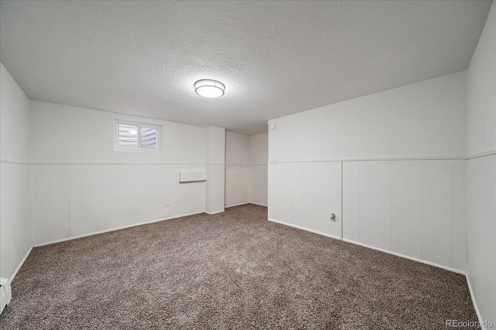 3738 Miller Court Wheat Ridge, CO 80033 - Photo 15 of 20 an empty room with an entryway