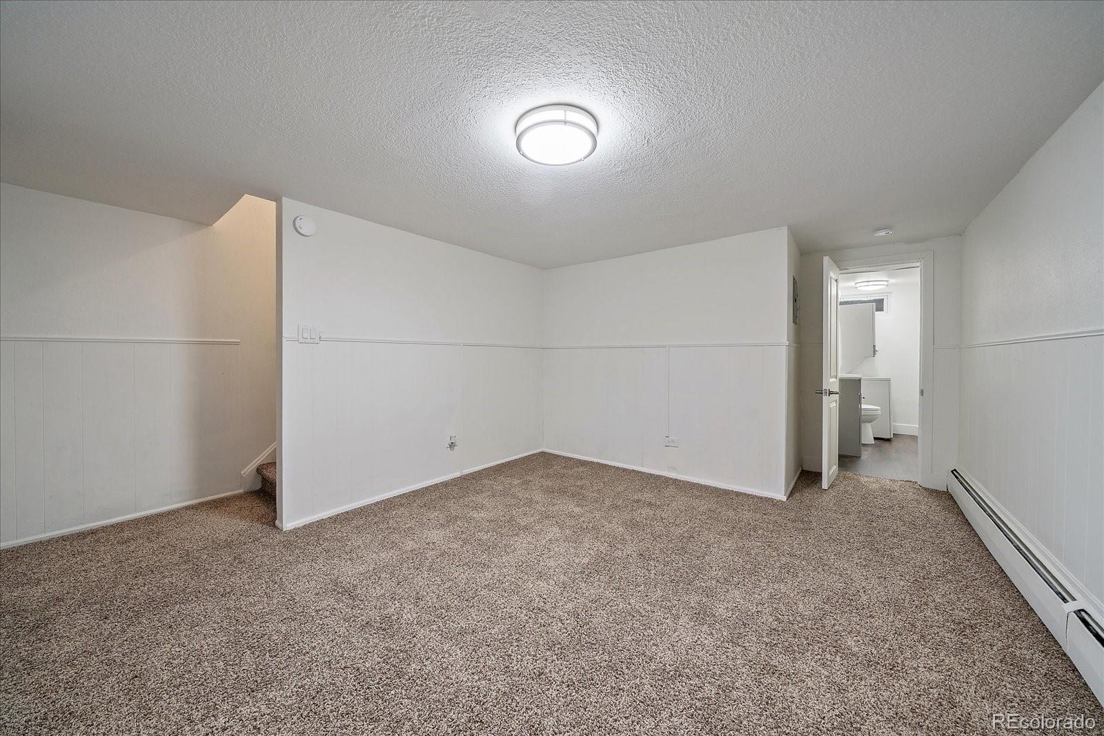 3738 Miller Court Wheat Ridge, CO 80033 - Photo 16 of 20 an empty room with closet and windows