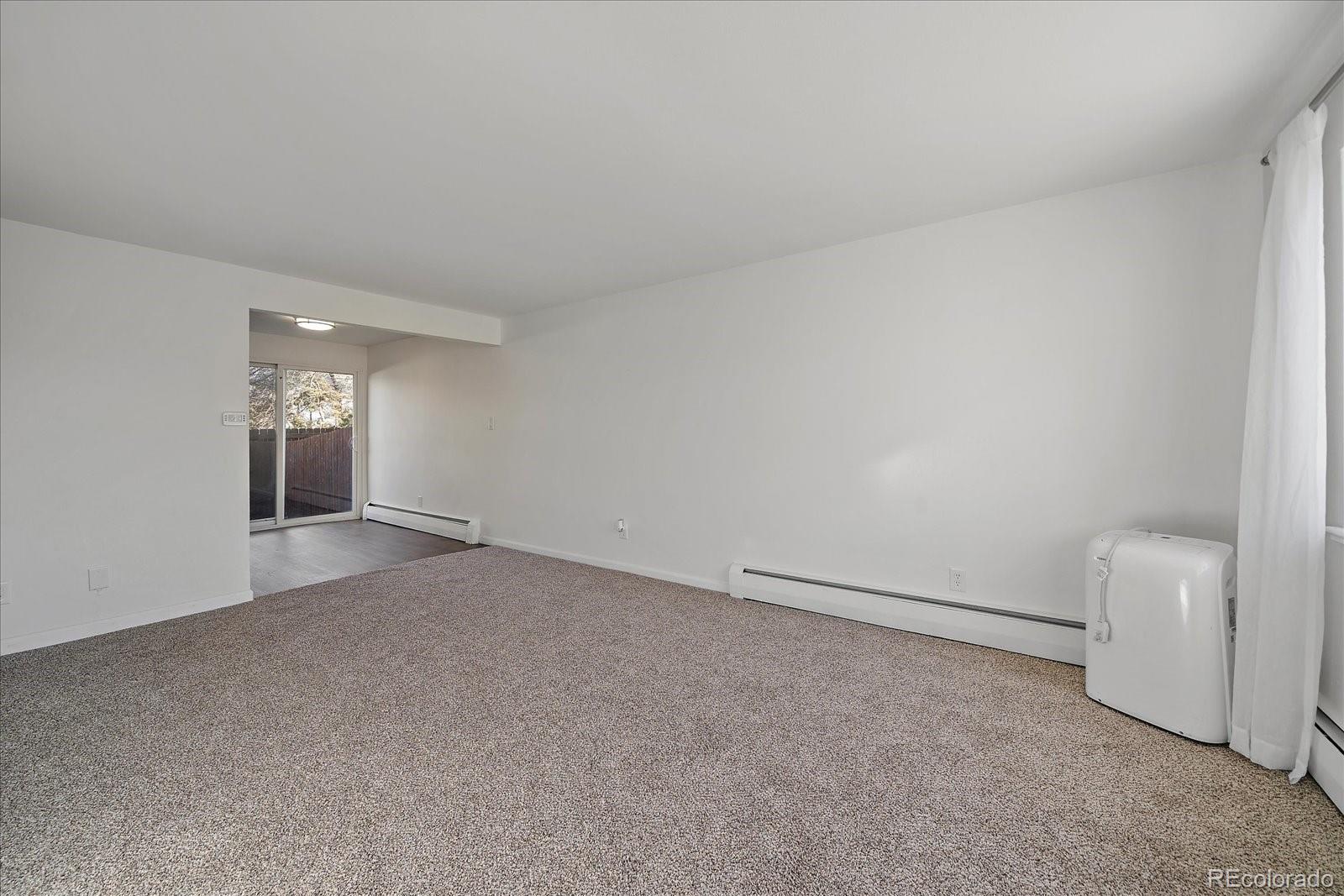3738 Miller Court Wheat Ridge, CO 80033 - Photo 18 of 20 a view of an empty room with a window