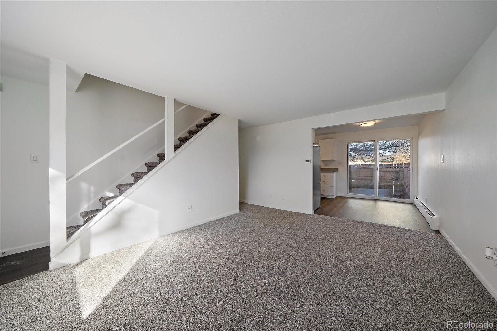 3738 Miller Court Wheat Ridge, CO 80033 - Photo 5 of 20 a view of an empty room with stairs