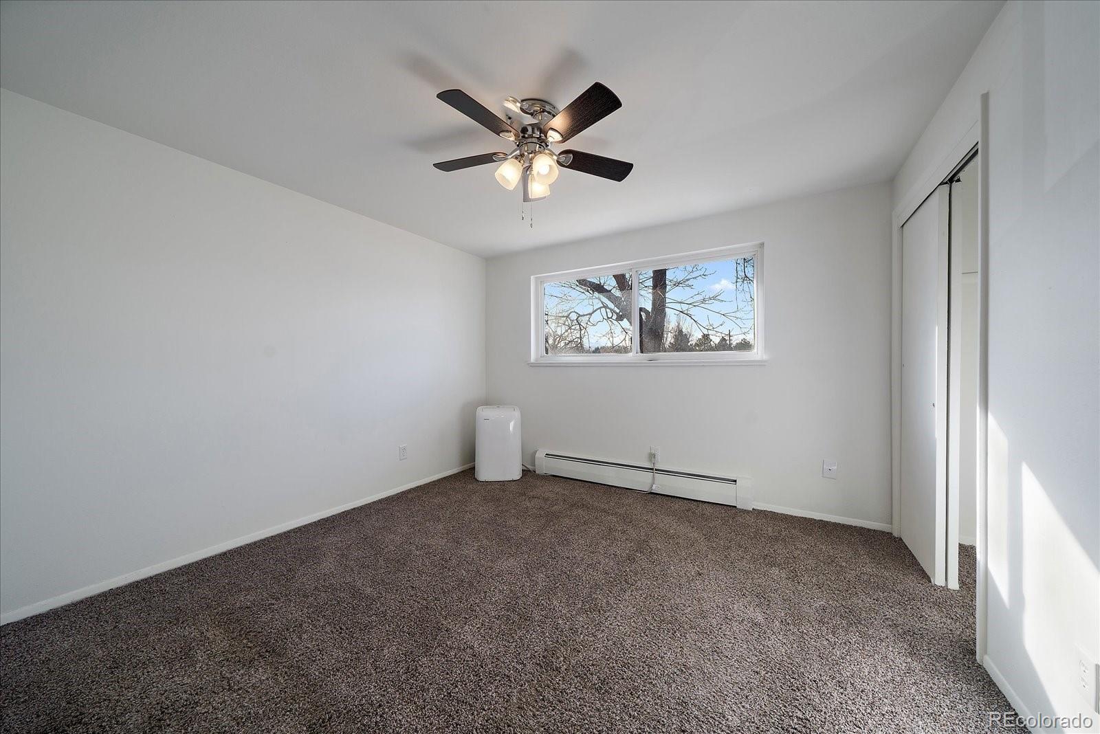 3738 Miller Court Wheat Ridge, CO 80033 - Photo 10 of 20 a view of an empty room with a window
