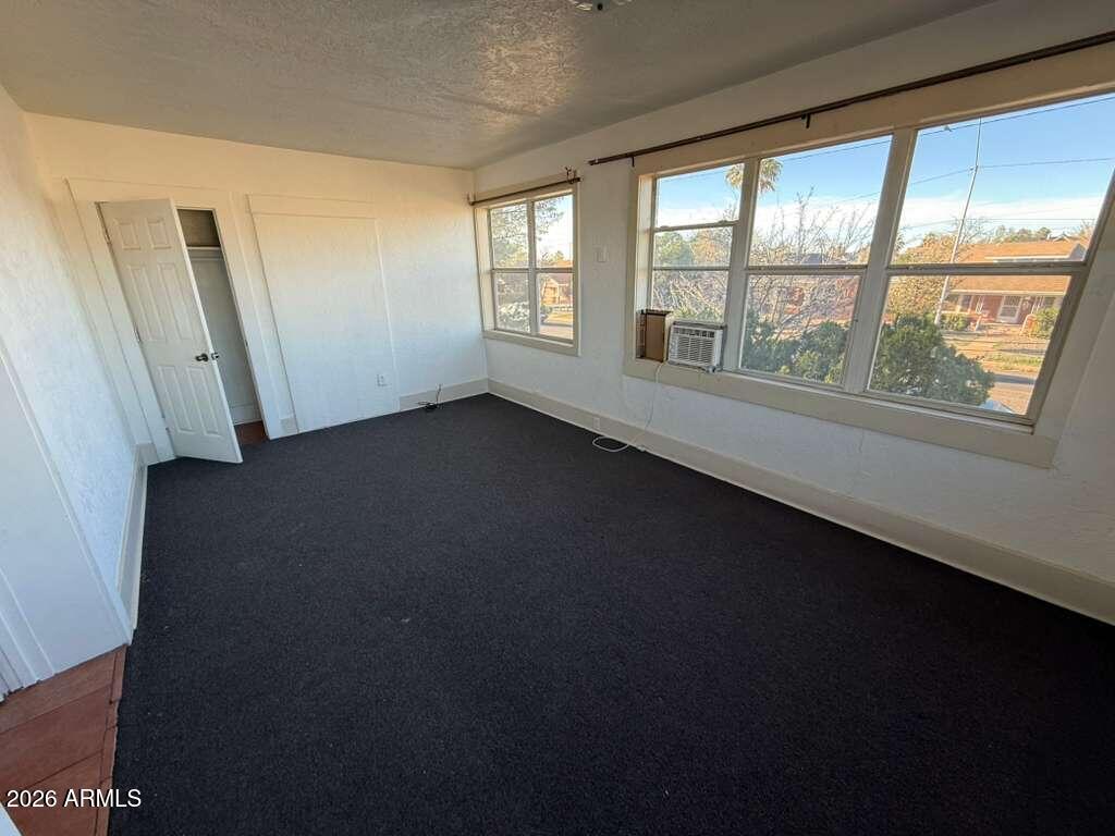 1165 East 10th Street, Unit 3 Douglas, AZ 85607 - Photo 15 of 22 a view of an empty room with a window