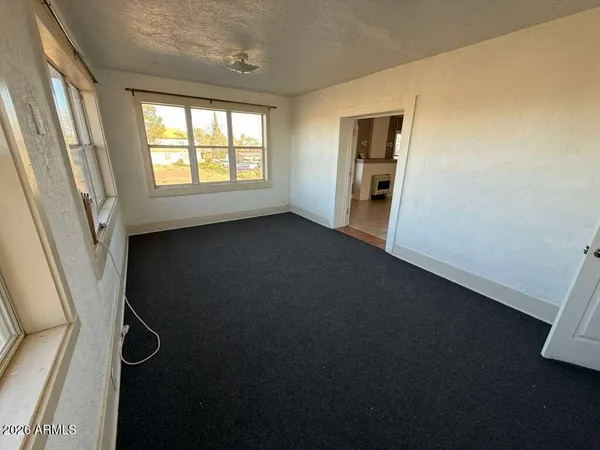 a view of an empty room with a window