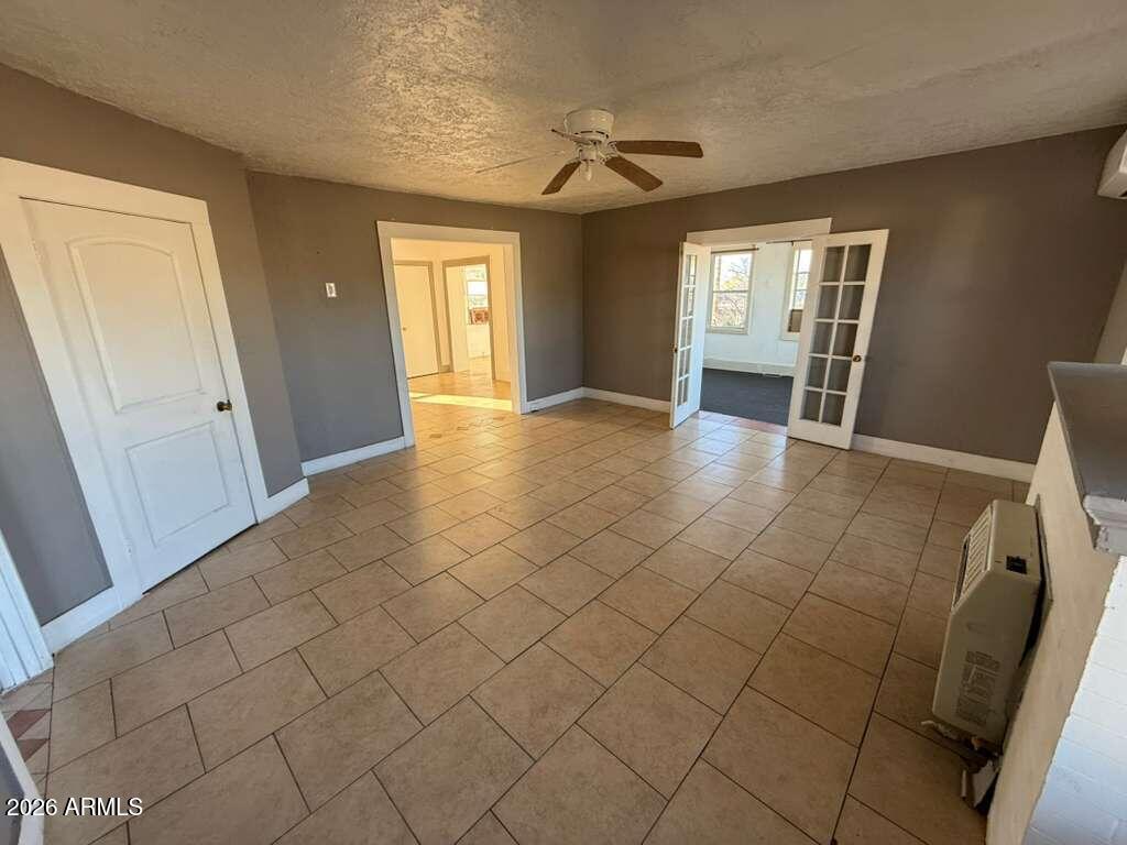 1165 East 10th Street, Unit 3 Douglas, AZ 85607 - Photo 19 of 22 a view of an empty room and window
