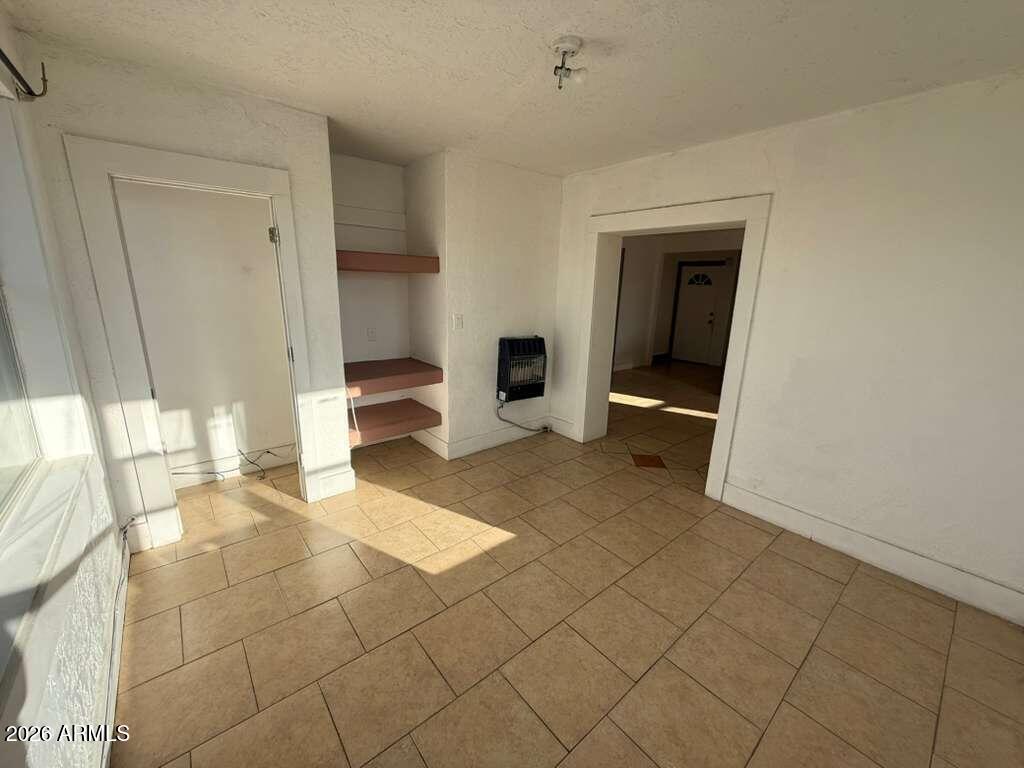 1165 East 10th Street, Unit 3 Douglas, AZ 85607 - Photo 21 of 22 a view of an empty room and window