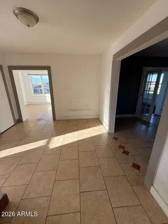 a view of an empty room and a window