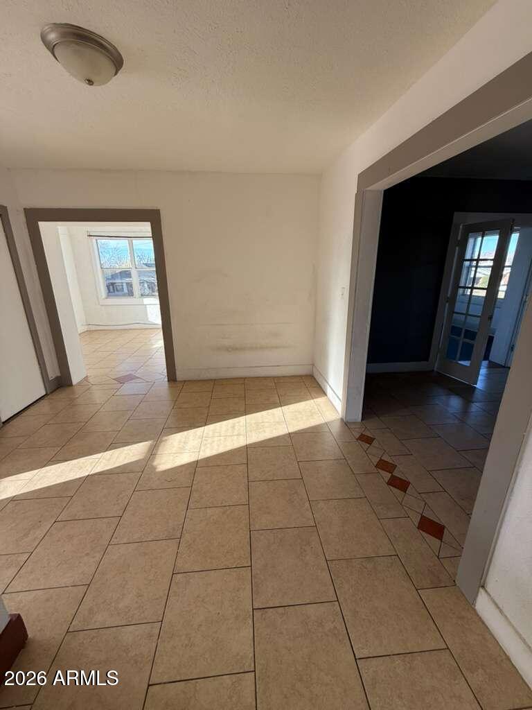 1165 East 10th Street, Unit 3 Douglas, AZ 85607 - Photo 3 of 22 a view of an empty room and a window