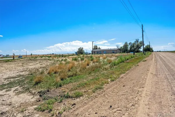 a view of a road with an ocean view
