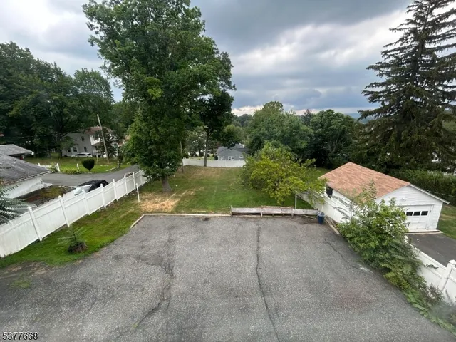 a view of house with yard