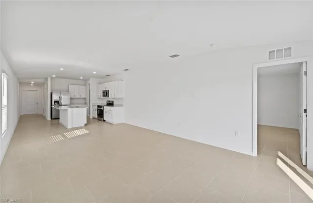 a view of kitchen with furniture and window