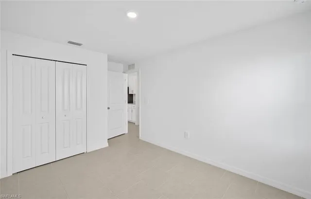 a bathroom with a sink toilet vanity and shower
