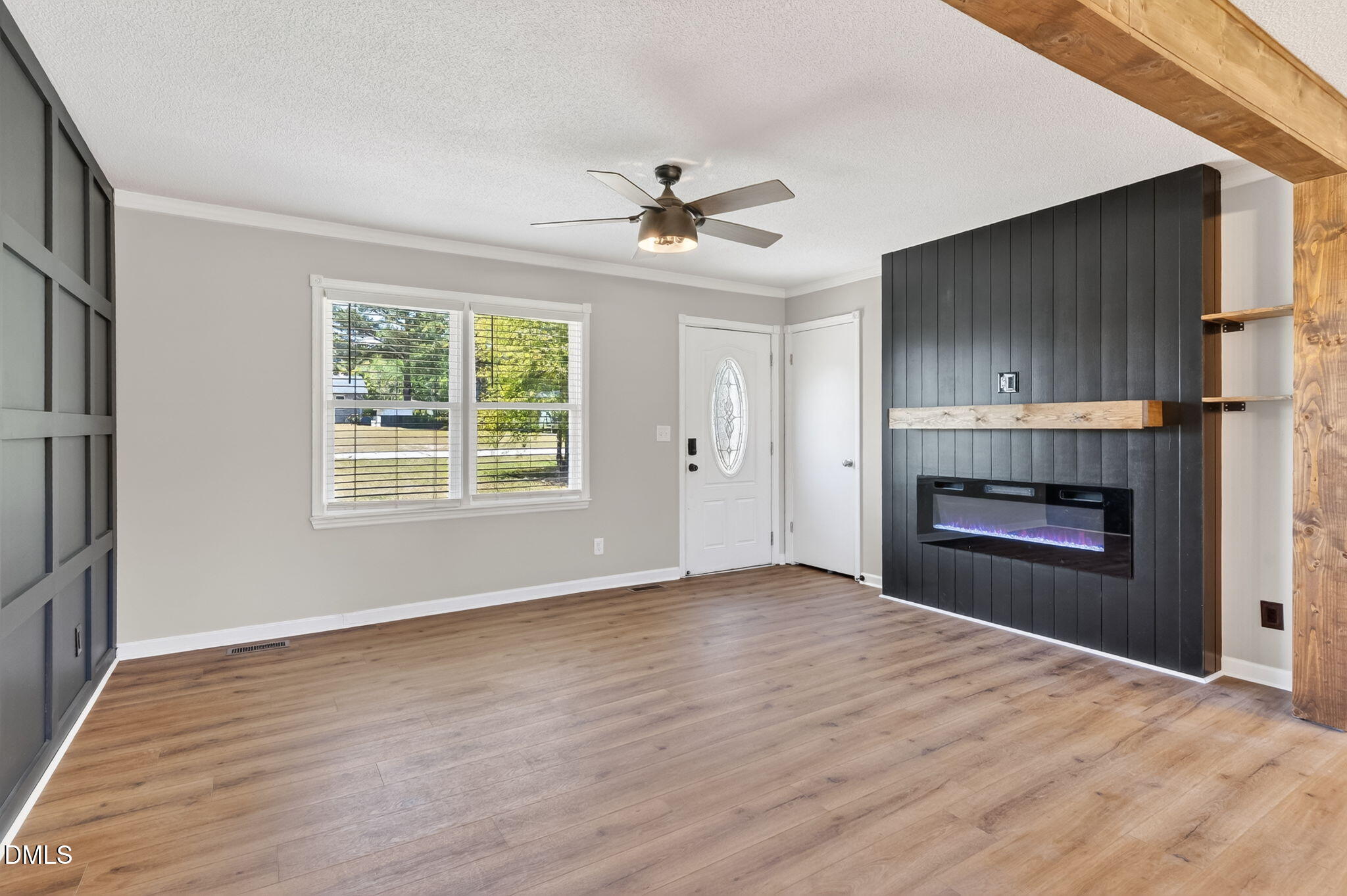 6086 Red Hill Church Road Coats, NC 27521 - Photo 6 of 44 an empty room with windows and fireplace