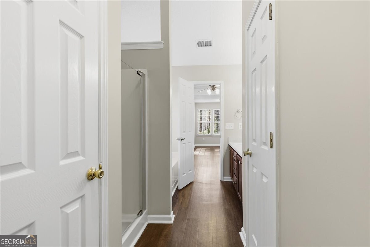946 Damson Trail Hampton, GA 30228 - Photo 24 of 37 a view of hallway with wooden floor