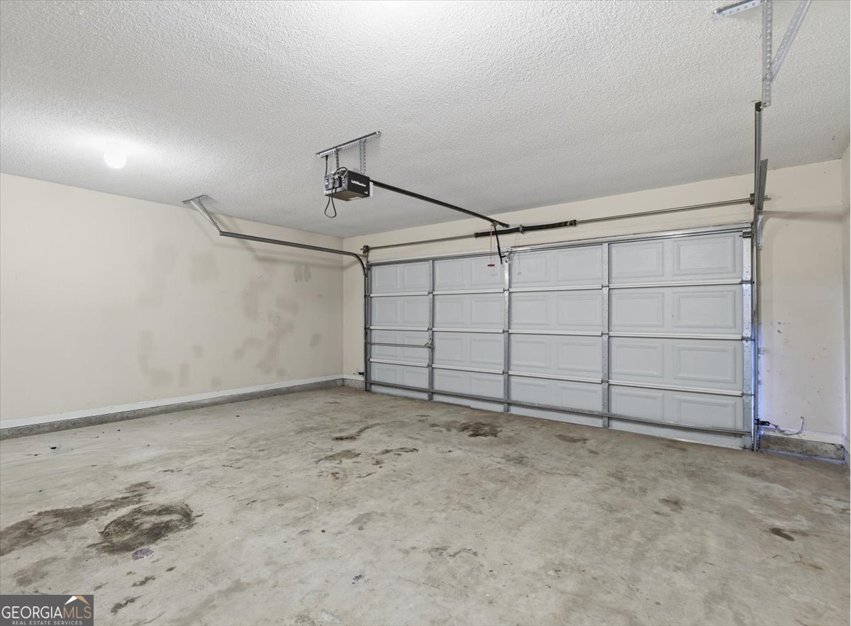 946 Damson Trail Hampton, GA 30228 - Photo 31 of 37 a view of a garage